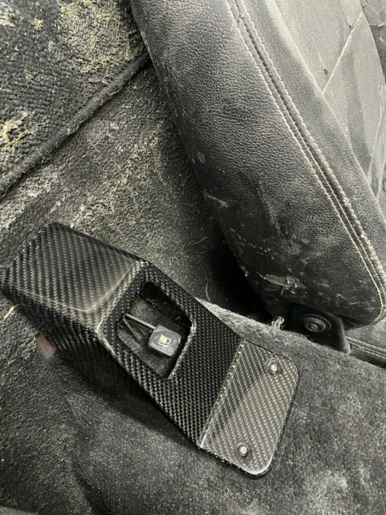 Upgrade Your Miata NA with a Sleek Carbon Fiber Trunk Lever Cover